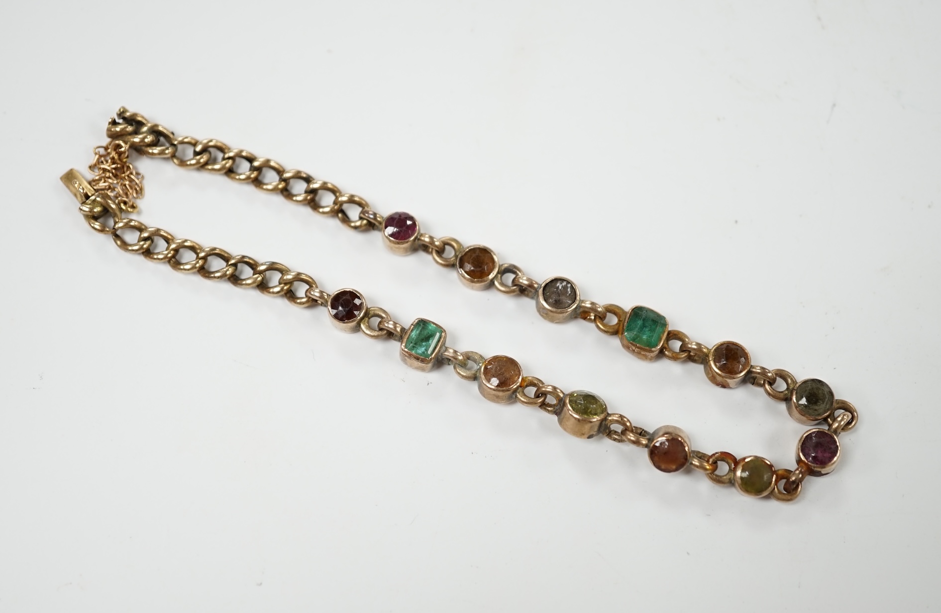 An early 20th century yellow metal and multi gem set bracelet, 19cm, gross weight 10.6 grams. Condition - poor